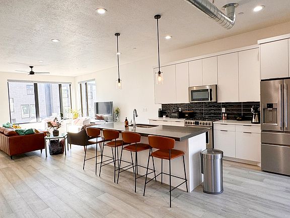 2nd floor open space with living room, kitchen, and dining area.