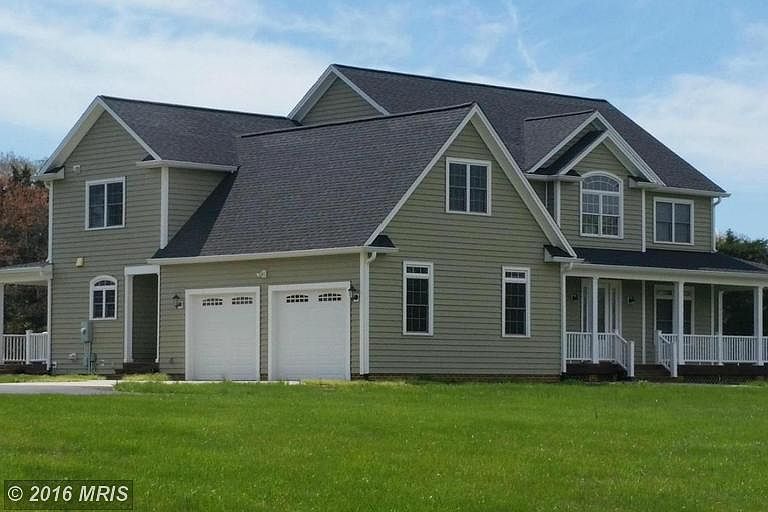 Side-load garage, front and back covered porches