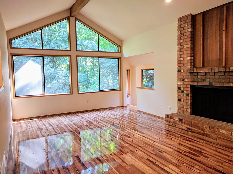The family room with fireplace opens up to the office.