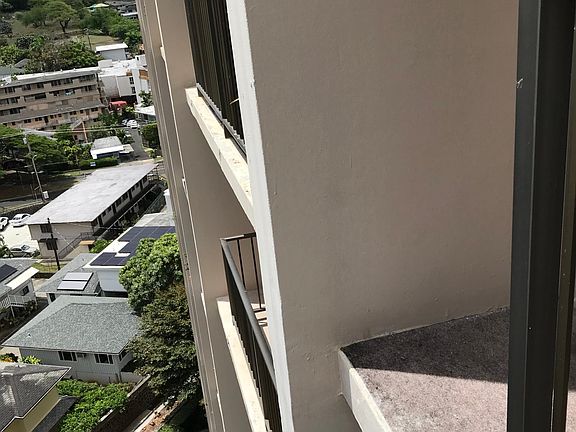 Standing in the Lanai is Side View of the Condo