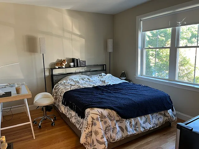 Comfortably fits a queen bed and dresser.