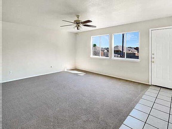 Family room leading to back covered patio.