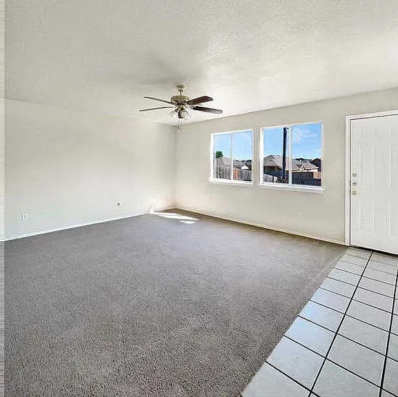 Family room leading to back covered patio.