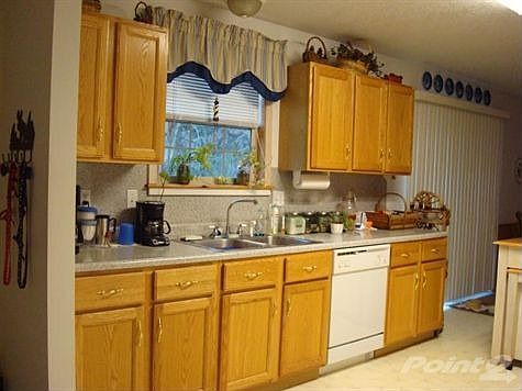 Kitchen are with main floor laundry.