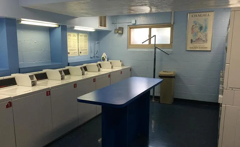 Laundry room is just steps from the apartment on the same level.