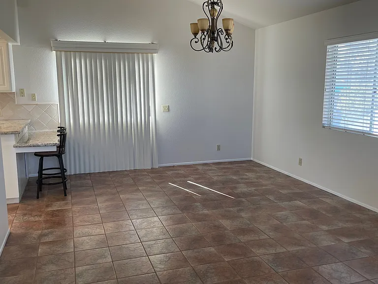 Dining Room - ceramic tile flooring runs through dining room, kitchen & primary bathroom & small hallway.
