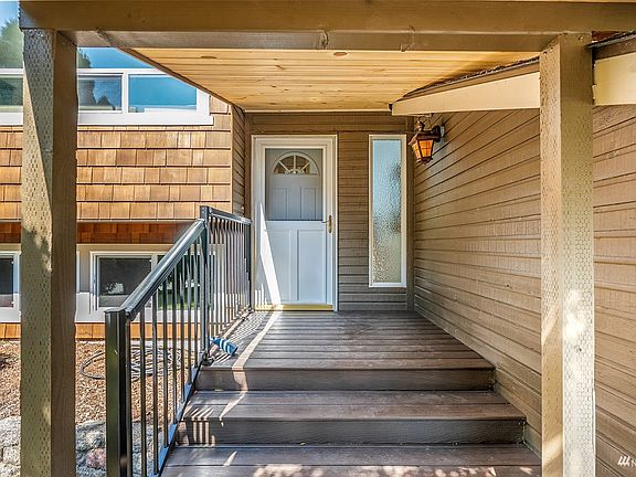 As you approach the front door, the extended front entryway keeps you covered with beautiful pine soffits.>