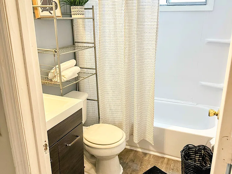 Bath with tub shower combination . Linen closet included.
