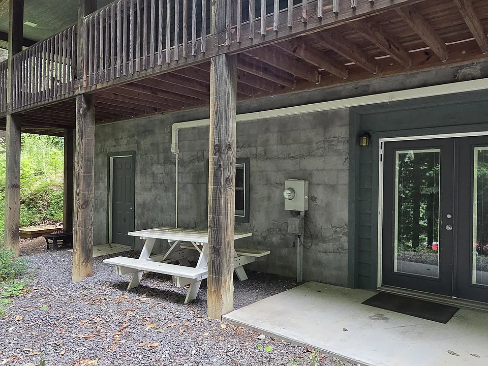 French doors and a picnic table to enjoy the mountain scenery.