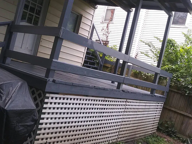 Shared Back Porch. New Boards and Newly Painted! New Rustic LED Lighting. Lattice to be Painted White.
Pergola to be Installed for upstairs tenants, allowing each apartment to have their own private outdoor space,