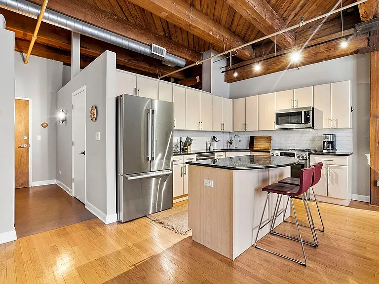 Fully equipped kitchen with island, gas stove, oven, microwave, dishwasher and garbage disposal!