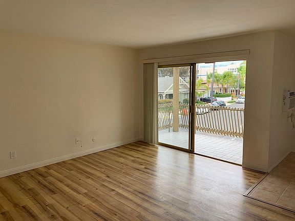 Living Room with Generous Balcony on Corner, Planked Flooring