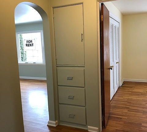 hallway between living room and both bedrooms