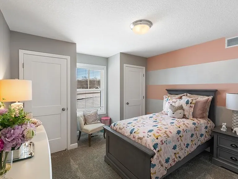 This bedroom has two separate closets !
