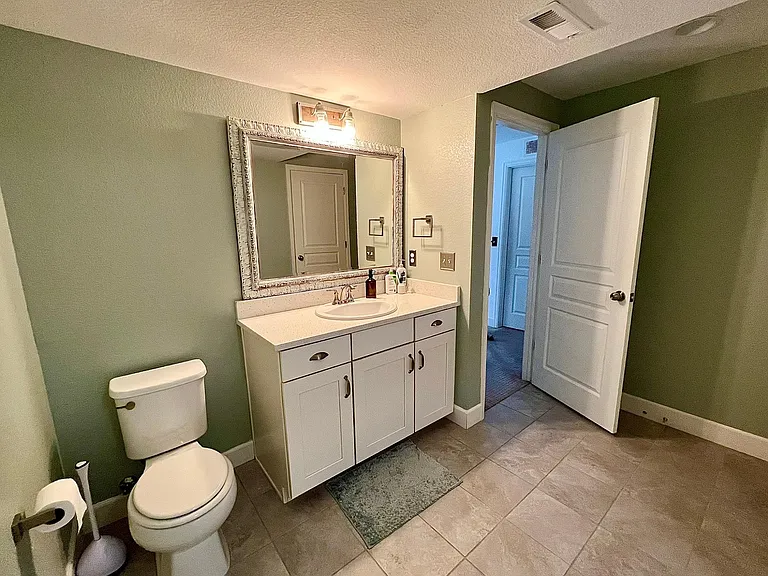 Bathroom with shower in basement