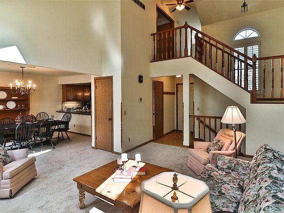 The great room also opens to the kitchen and to the very impressive open staircase to the second floor and lower level