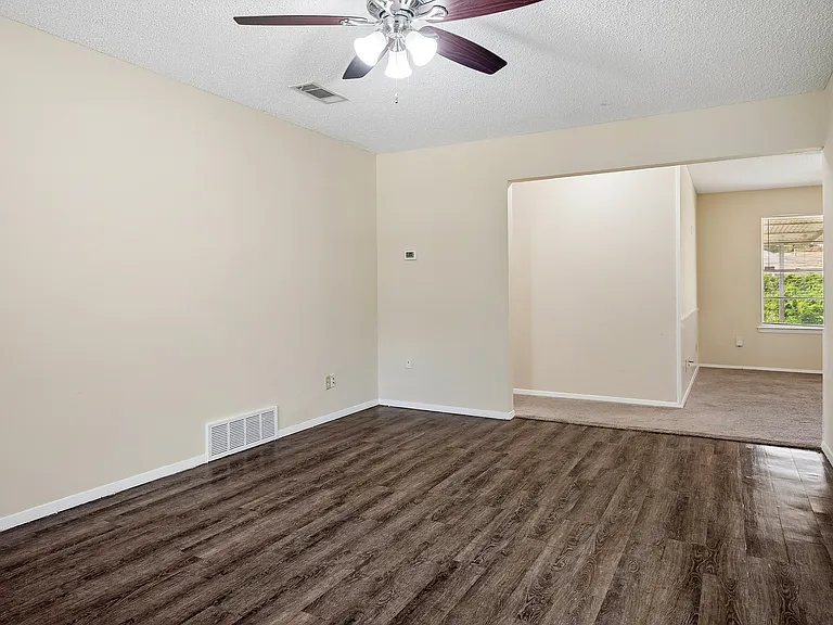 Living & Dining Areas with entrance to the den.