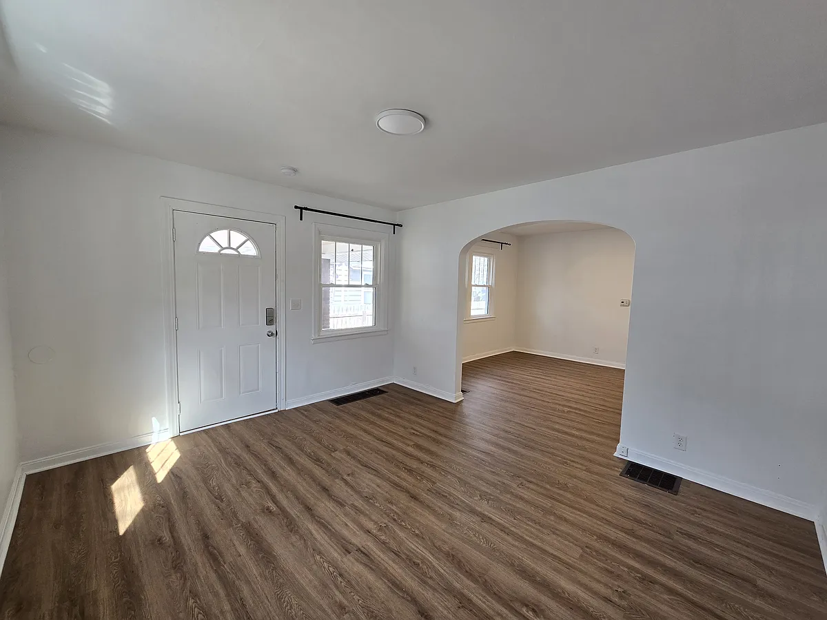 Living room with arch into dining room - 49 N Oakland Ave