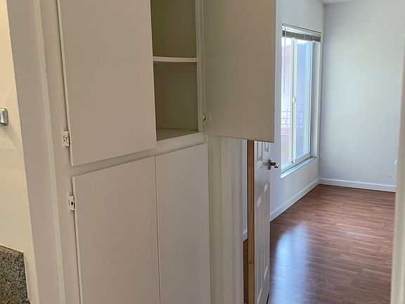 LINEN CLOSET NEXT TO SINK AND VANITY
