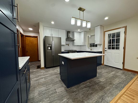 View of kitchen and side door.