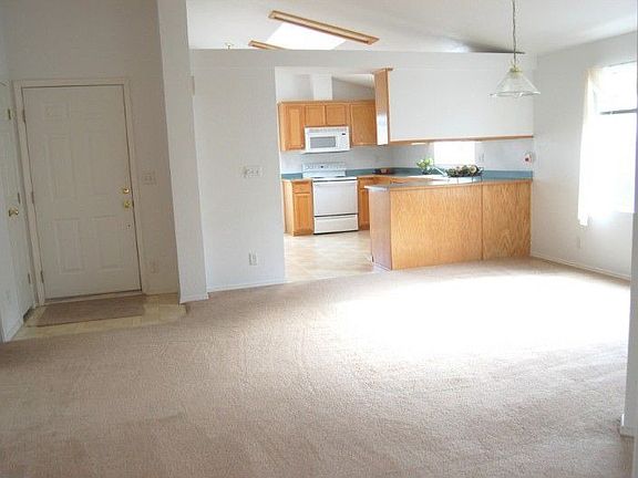 ENTRANCE ON LEFT. NICE SIZE DINING ROOM IS OPEN TO LIVING ROOM. KITCHEN W/BREAKFAST BAR