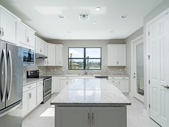 Model Representation Well-appointed kitchen with plenty of natural light and storage in the 42 map