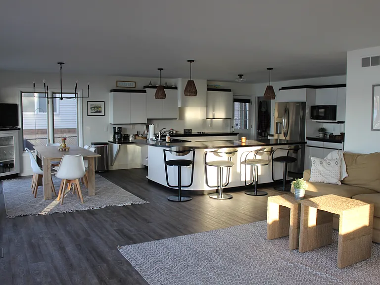Kitchen, dining and sitting area with new floors throughout