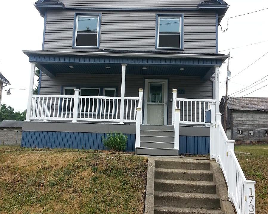 Front of House with lifetime decking on front poarch