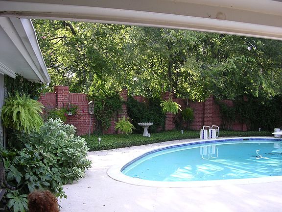 Pool with brick privacy wall
