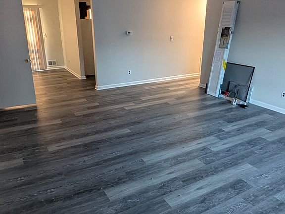 Entrance View, Huge Living area, with Kitchen of far right diagonal and adjacent Dining Room