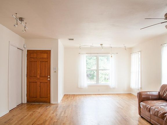 Sunny dining area with tree filled views