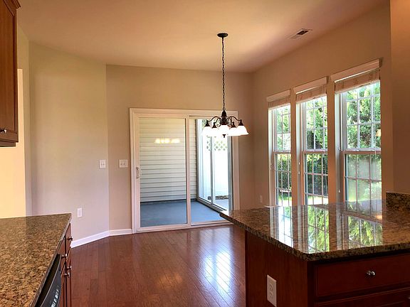 Dining Area. Enjoy shaded, Screen Porch with outdoor fan and Patio