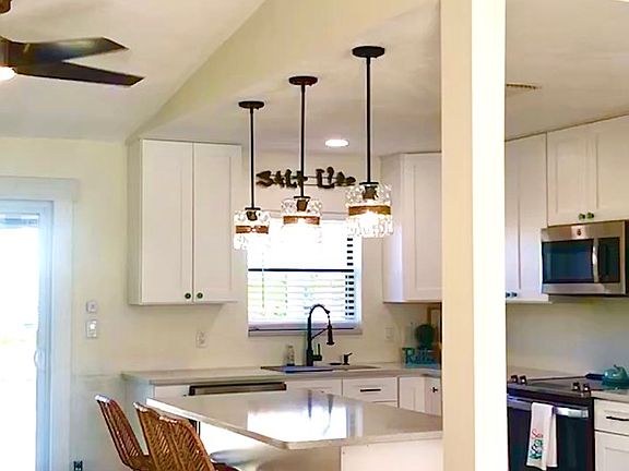 Vaulted ceilings and open beam feel light and airy