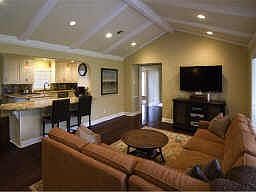 Another view of this handsome family room which shows how it opens up to the kitchen. While mom cook
