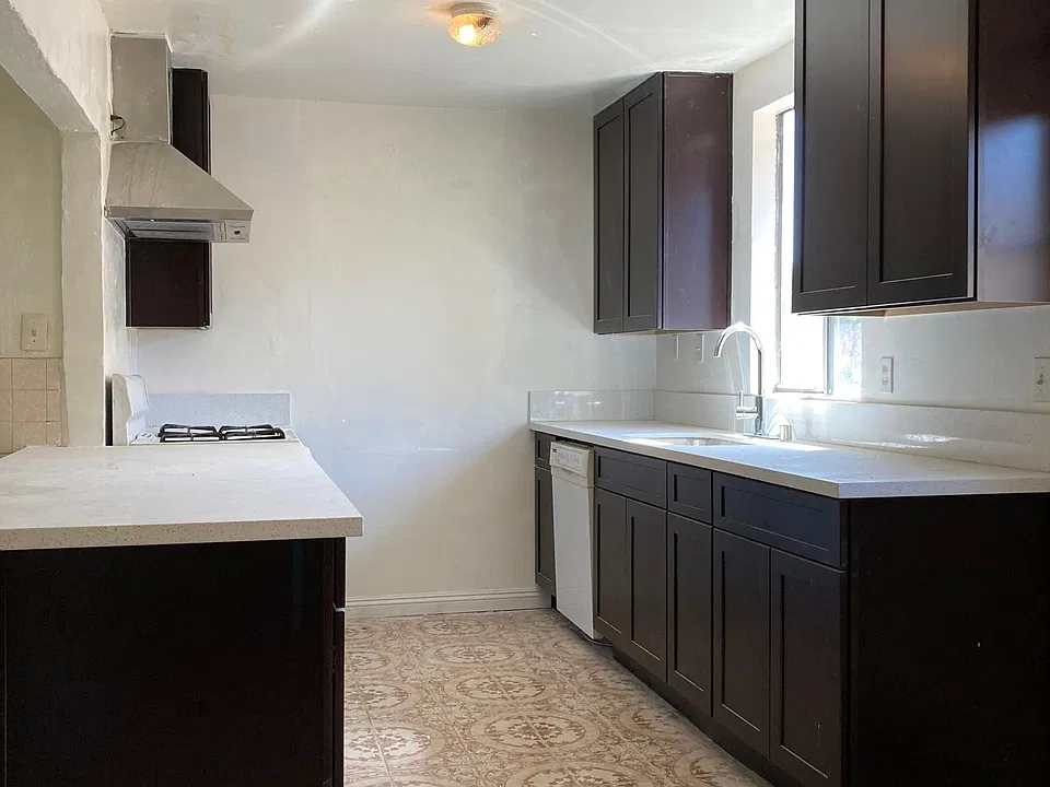 Kitchen with brand new quartz countertops and brand new cabinets