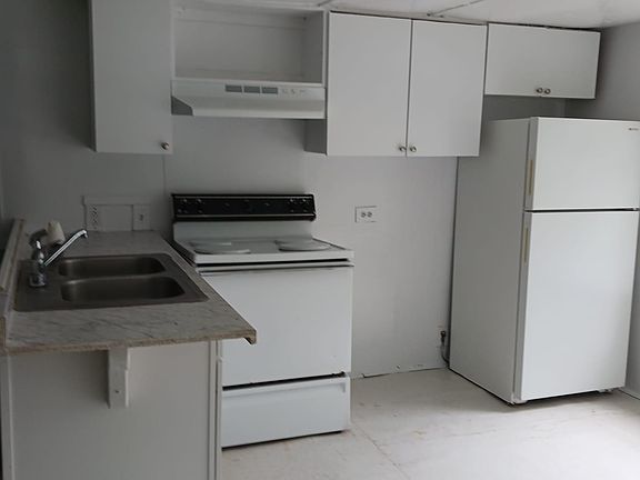 Double sink with Fridge and stove included in rental.