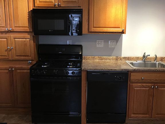 Kitchen with microwave, gas range and dishwasher
