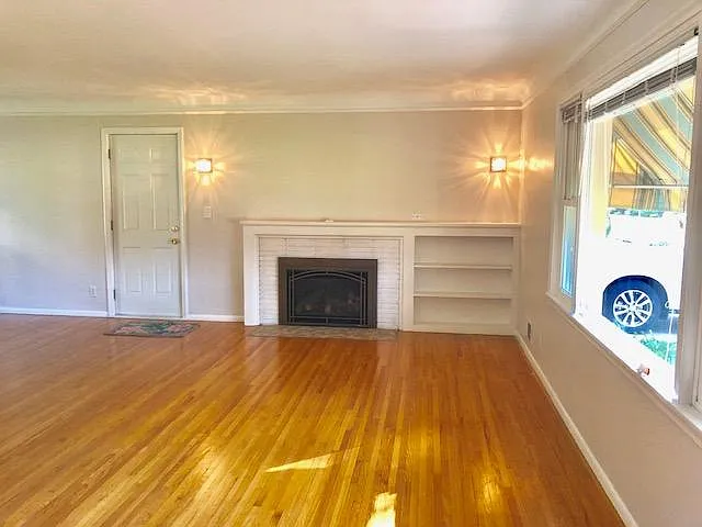 Empty living room with gas fireplace