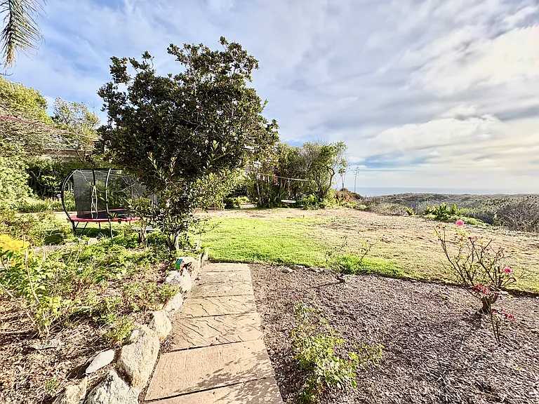 Large landscaped yard with ocean view from all areas.