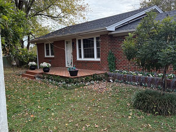 View from driveway side, inside fence