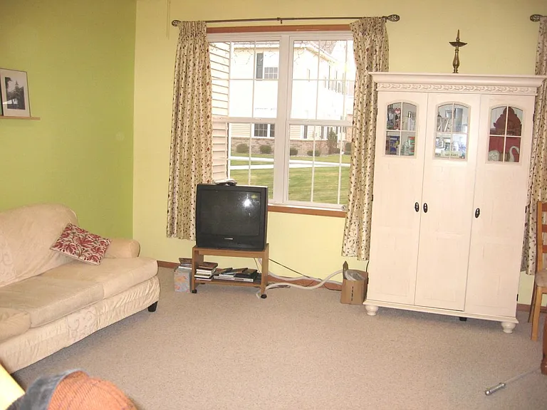Family room to show scale of furniture. Before home was freshly painted top to bottom.