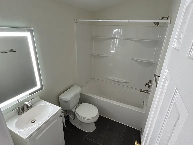 Inside of the second full bathroom for the other two rooms