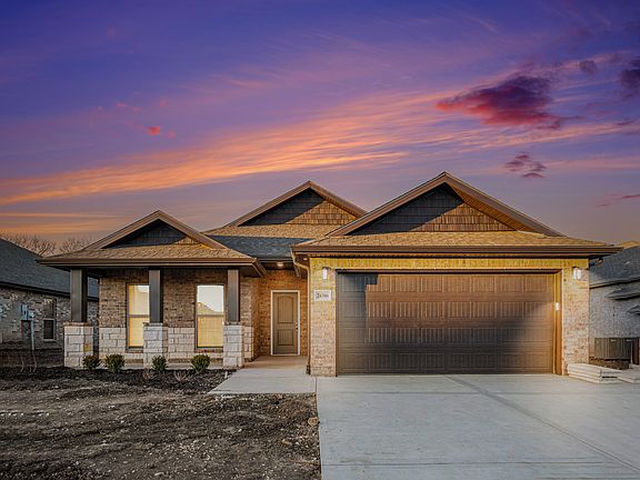 Photos were taken before this new home construction was completed. There is now beautiful sod, a sprinkler system, and landscaping in the front yard