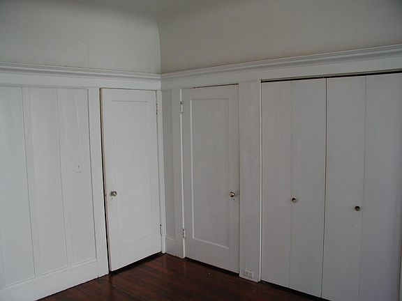 The wall of closets! (Before new paint)