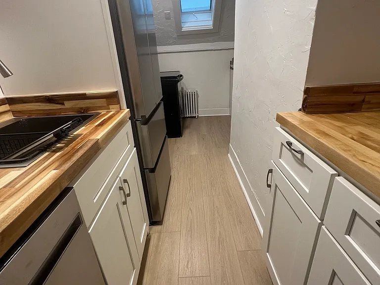 Newly remodeled kitchen w/ new refrigerator and dishwasher. A new venting skylight with shade was installed and also has electric stove.