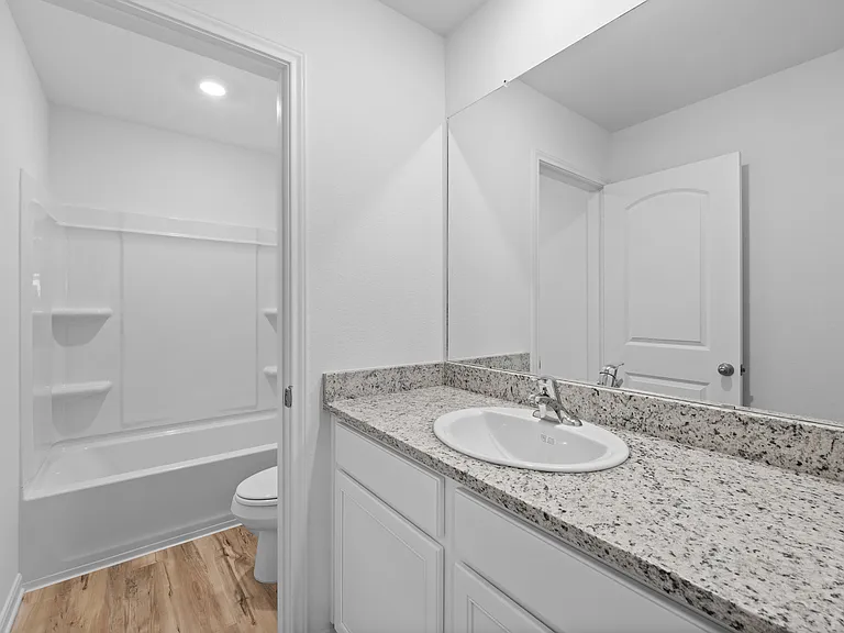 Full bathroom upstairs with excellent counterspace.