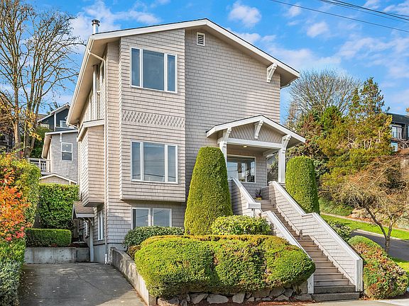 Lower level unit on the left. Parking pad offstreet for this home.