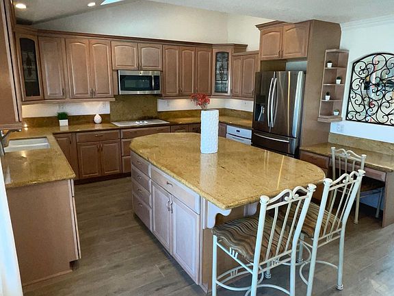 Kitchen with Large island. New porcelain tile throughout the entire downstairs. ***More photos soon.