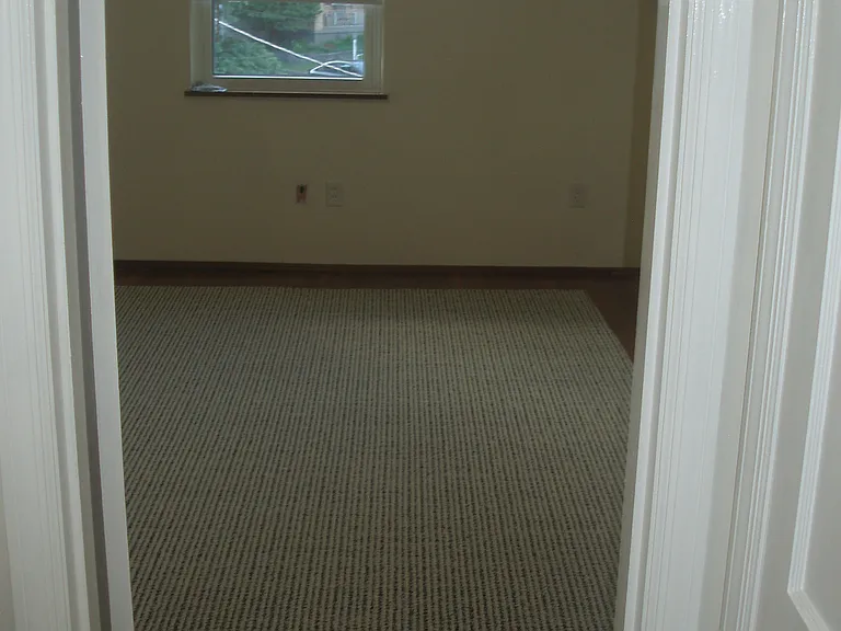 2nd floor front bedroom, 12x15, all rugs stay on site