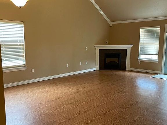 Living room with fireplace (view from entry hallway)